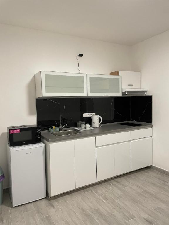 Kuchyň nebo kuchyňský kout v ubytování Apartmant T&T