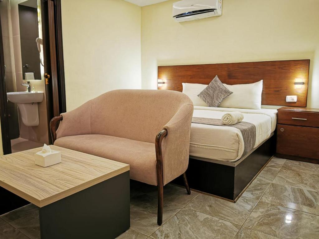 Łóżko lub łóżka w pokoju w obiekcie TAJ Hotel