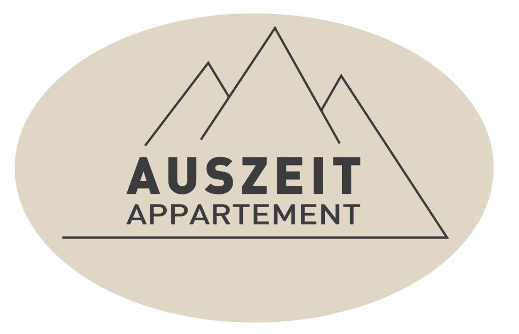 um logótipo para um acordo de avaliação de ativos em AUSZEIT Appartement em Schladming