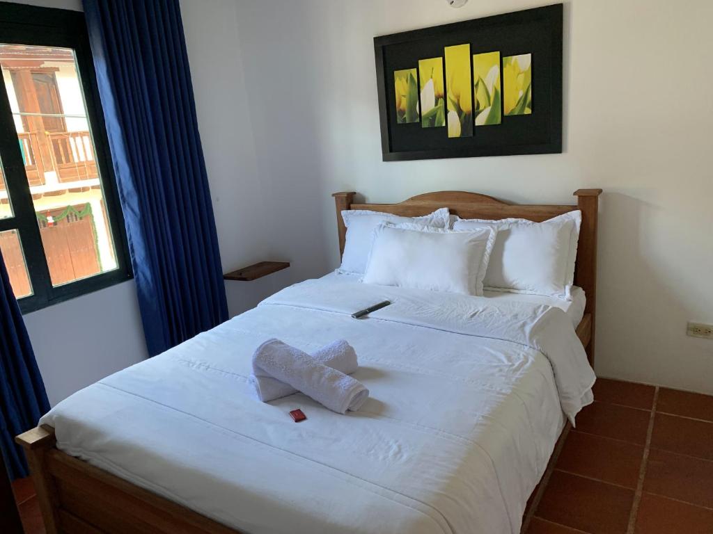 Postel nebo postele na pokoji v ubytování Hostal Home Sant Angelo