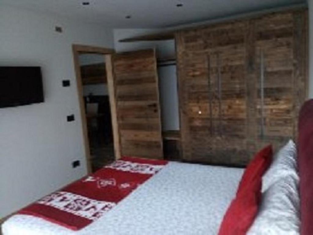 A bed or beds in a room at Baita Ricky