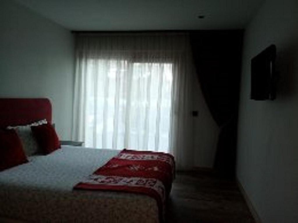 A bed or beds in a room at Baita Ricky
