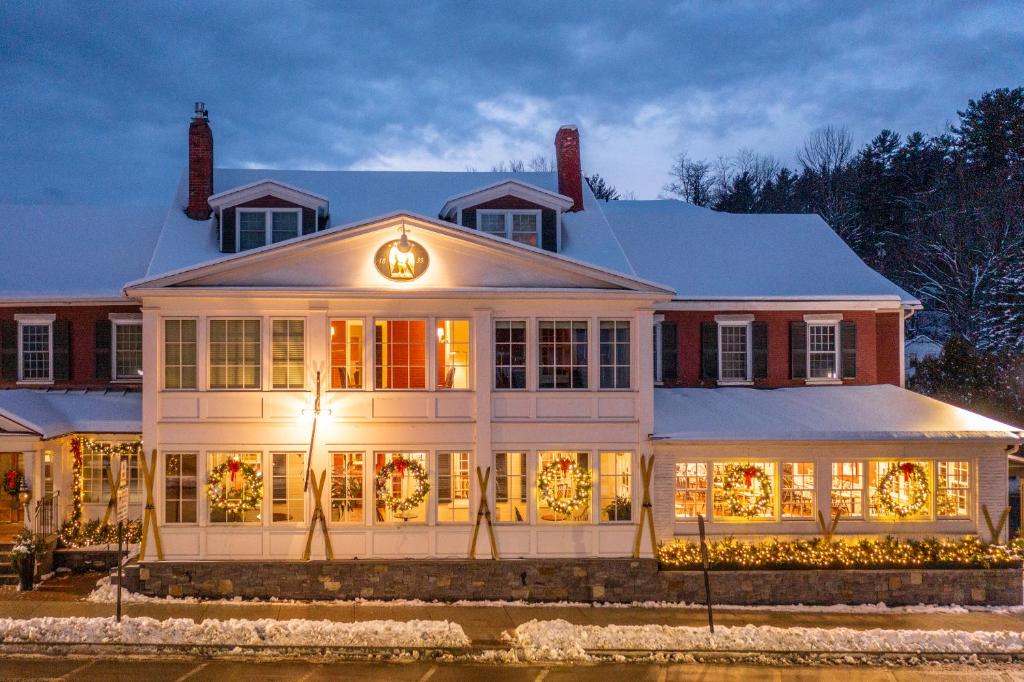 a house decorated for the holidays with christmas lights at Green Mountain Inn in Stowe