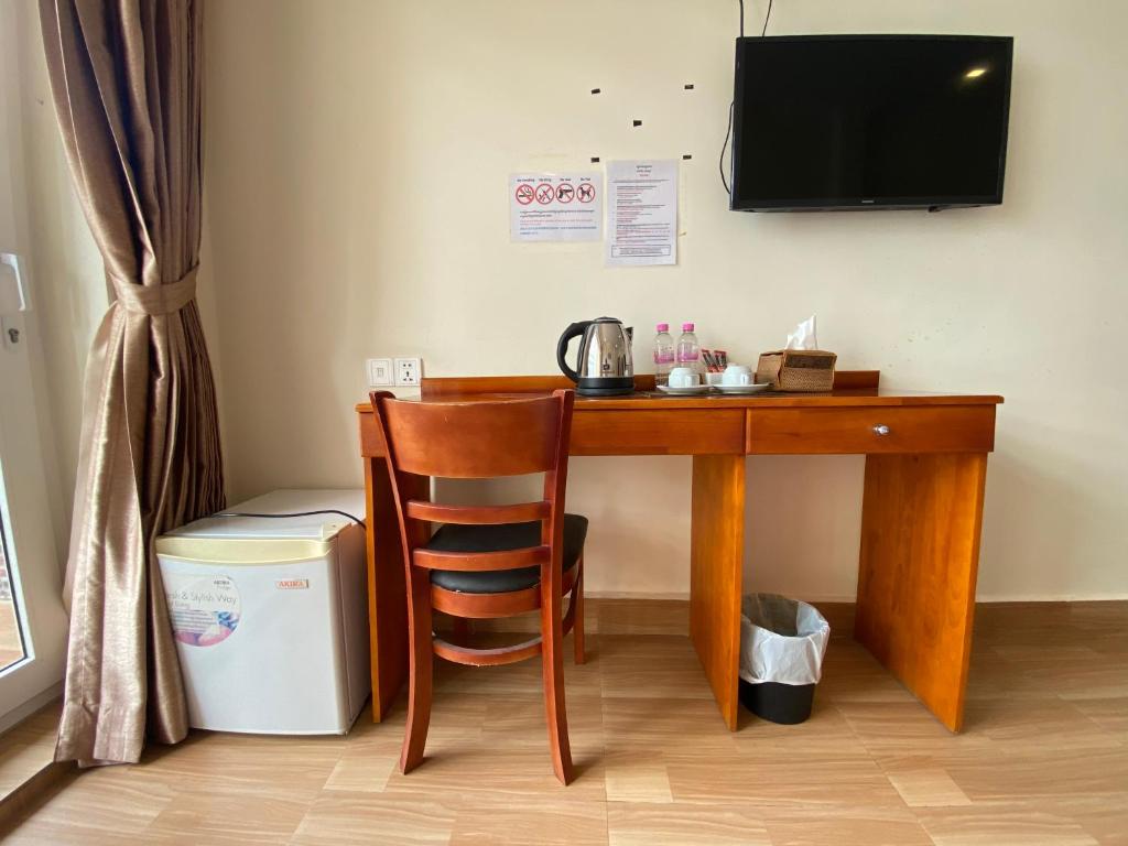 TV a/nebo společenská místnost v ubytování Phnom Penh Le Vincent Hotel