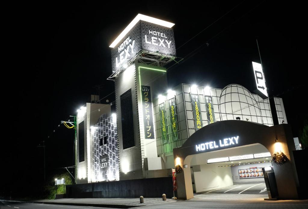 a night view of a building with lights on it at Hotel LEXY旧Tsubakikan Adult Only in Nara