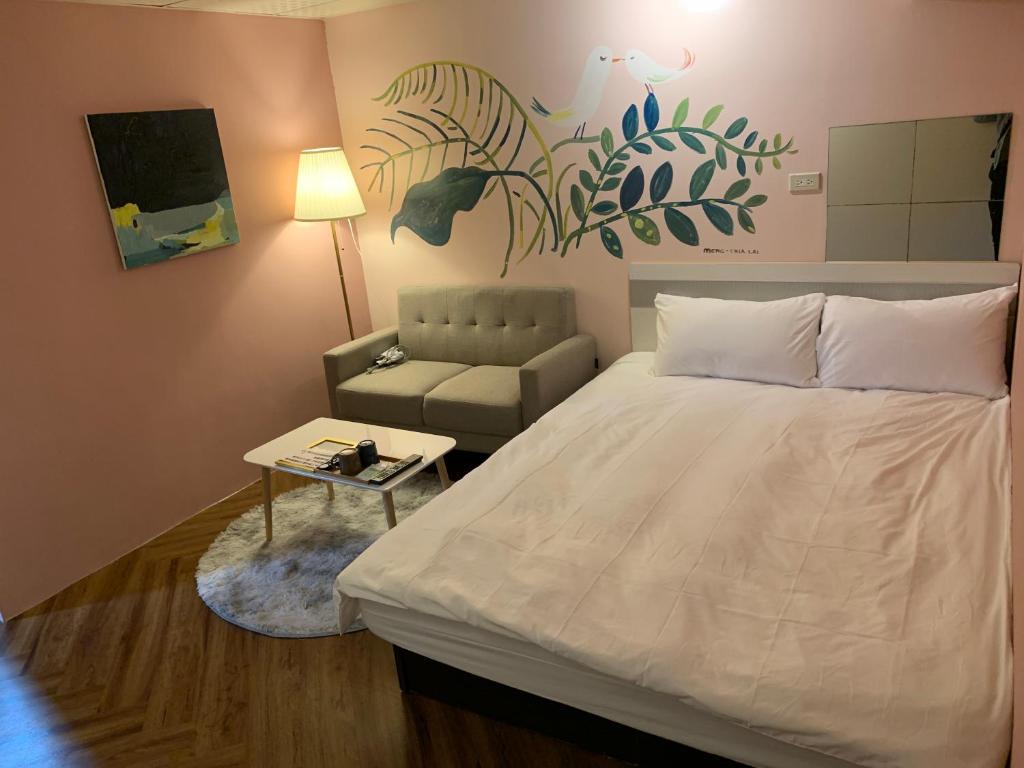Postel nebo postele na pokoji v ubytování 菜爺爺親子蔬宿Vegepapa B&B