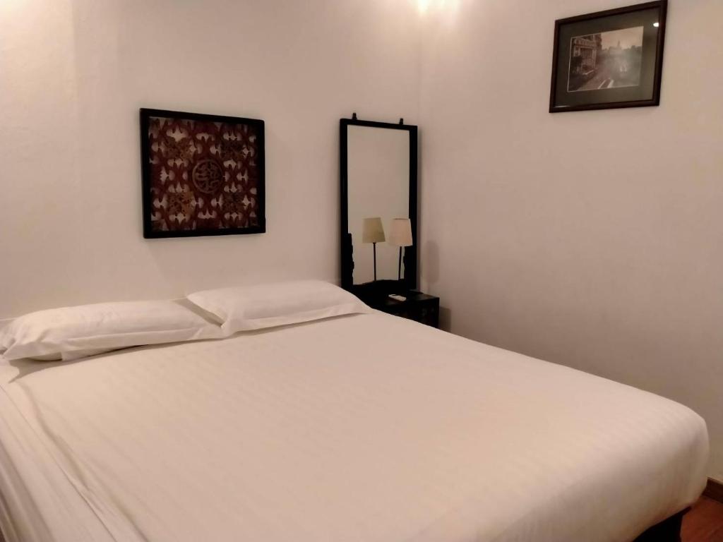Postel nebo postele na pokoji v ubytování BTC Hua Hin Home managed by BTC Boutique Resort