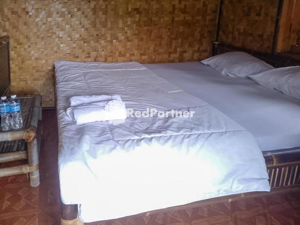 Postel nebo postele na pokoji v ubytování De Salak Homestay Gunung Salak RedPartner