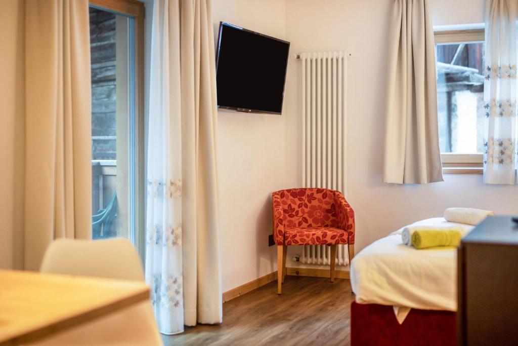 Postel nebo postele na pokoji v ubytování Chalet Osmar Suite 1