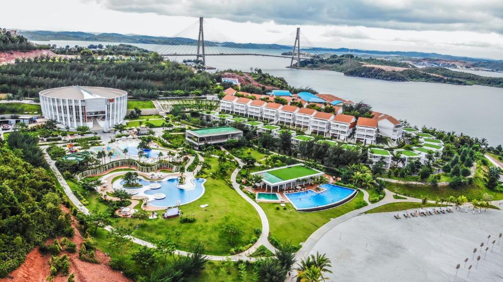 an aerial view of the resort and the water park at HARRIS Resort Barelang Batam in Sagulung