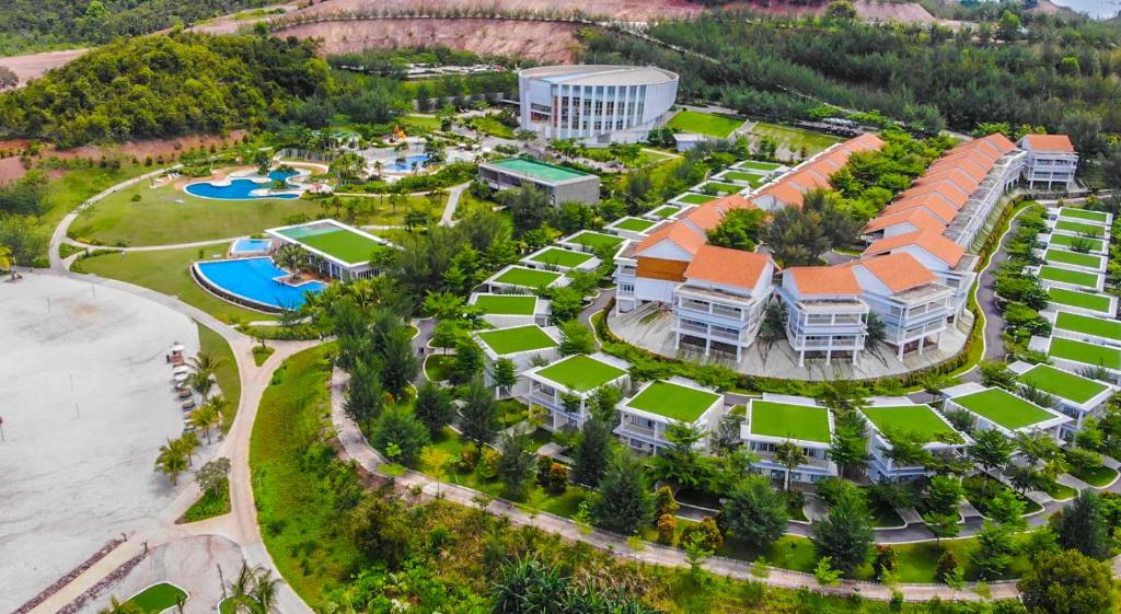 an aerial view of a resort with a pool at HARRIS Resort Barelang Batam in Sagulung