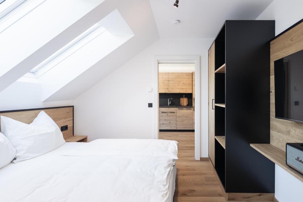 Posteľ alebo postele v izbe v ubytovaní Moxn Apartment Lungau - Small Penthouse mit Terrasse