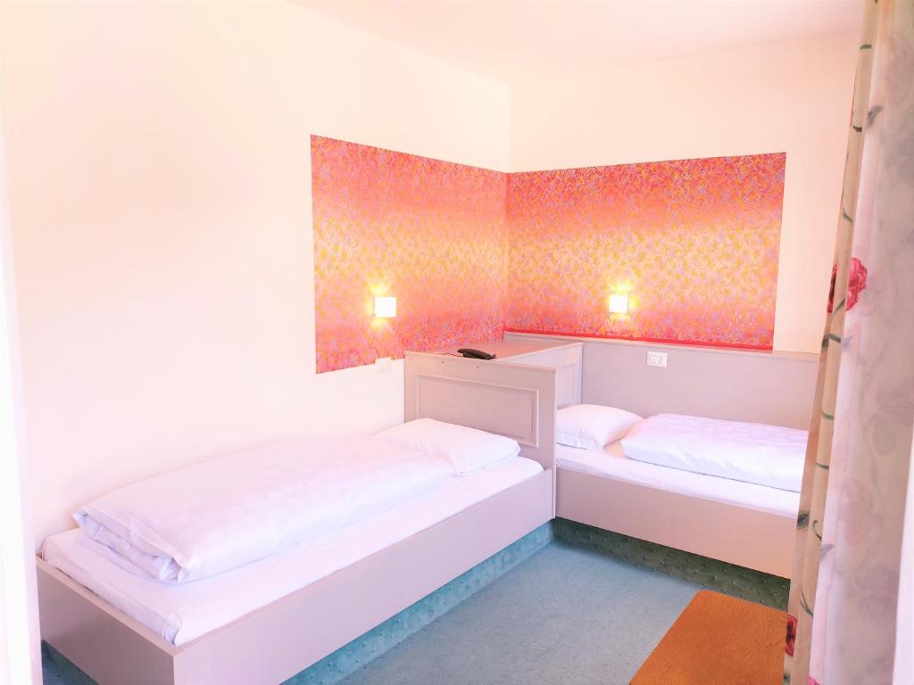 Voodi või voodid majutusasutuse Hotel Schuster toas