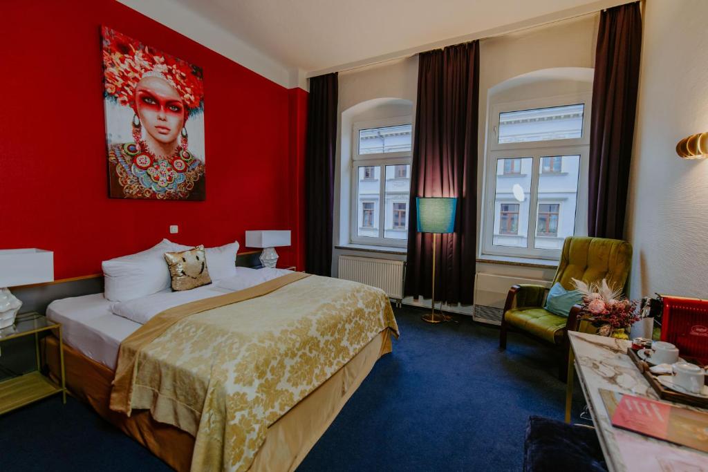 En eller flere senge i et værelse på Boutique Hotel Rothenburger Hof