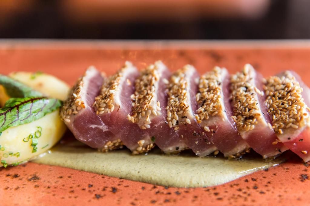 a close up of a piece of meat with nuts on it at The LINQ Hotel and Casino in Las Vegas