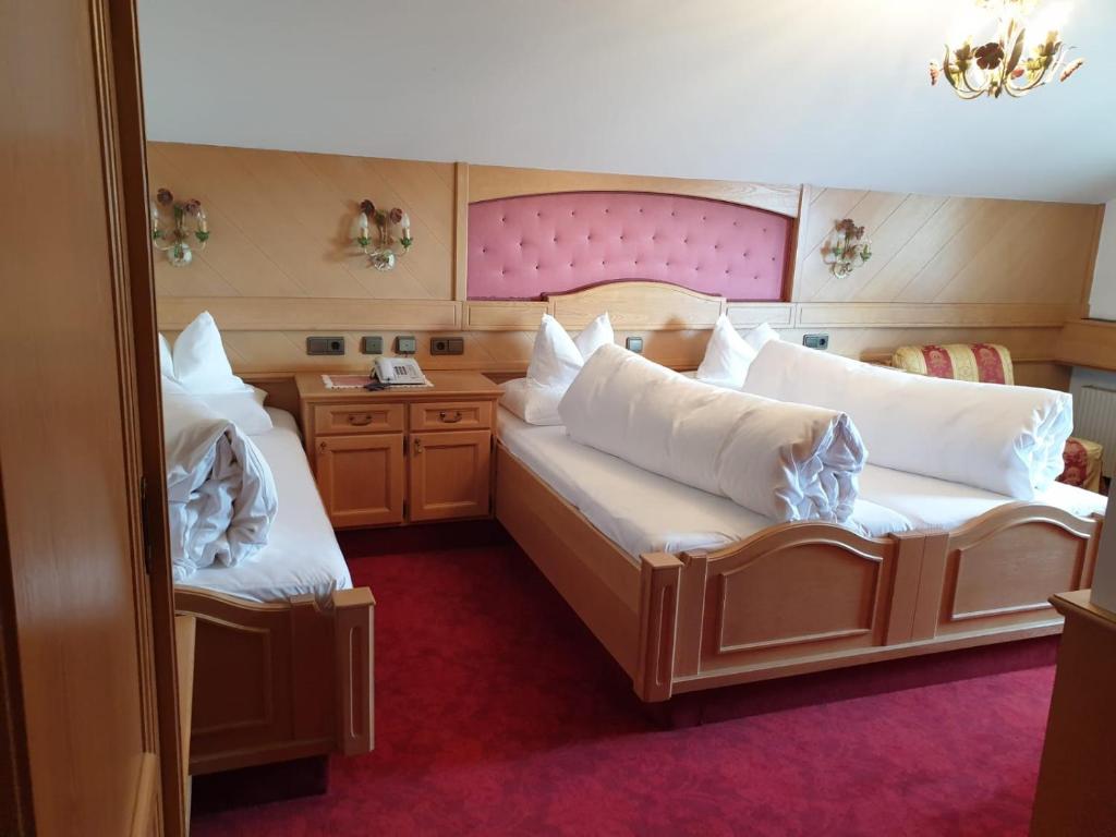 Postel nebo postele na pokoji v ubytování Hotel Purner
