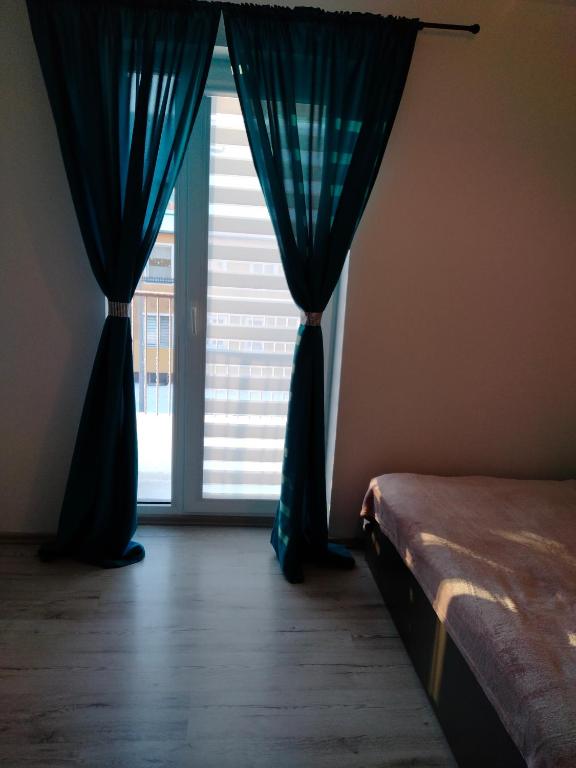 Posteľ alebo postele v izbe v ubytovaní Apartament Radość