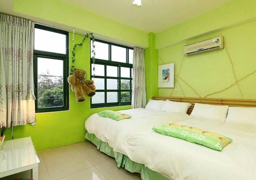 Postel nebo postele na pokoji v ubytování Wushih Surf Hostel