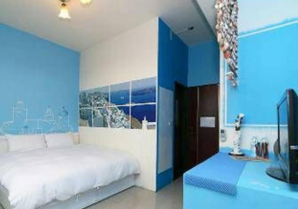Postel nebo postele na pokoji v ubytování Wushih Surf Hostel