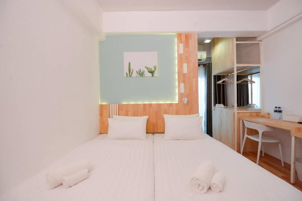 Postel nebo postele na pokoji v ubytování The Cozy Hotel