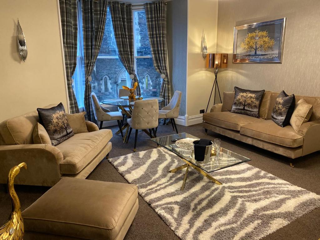 een woonkamer met een zebratapijt bij Merewyke Boutique Luxury Family Apartment Sleeps 4 , Central Location in Windermere