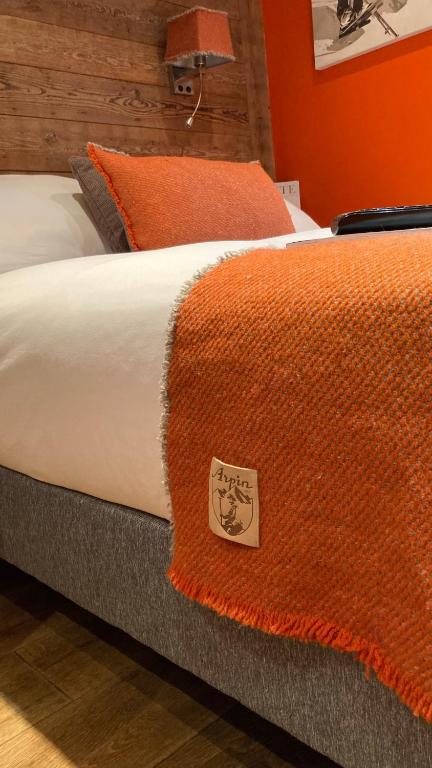 Postel nebo postele na pokoji v ubytování Hôtel Les Cimes