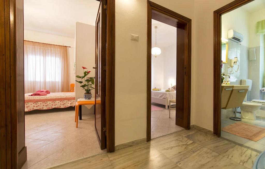 A bed or beds in a room at Cervi flat close to the sea and the historic centre of Alghero