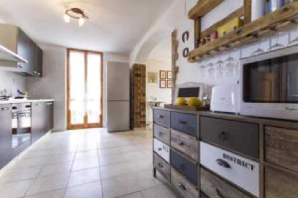 A kitchen or kitchenette at ClickSardegna Villa Emanuel ad Alghero con Vista mare spettacolare, piscina indipendente per 8 persone