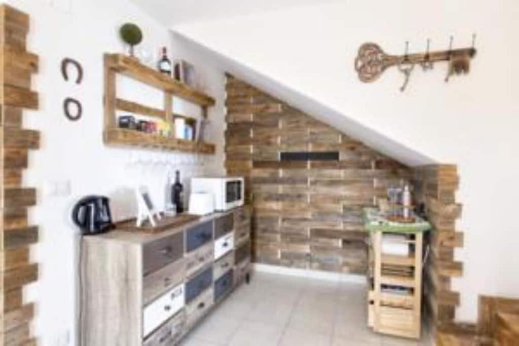 A kitchen or kitchenette at ClickSardegna Villa Emanuel ad Alghero con Vista mare spettacolare, piscina indipendente per 8 persone