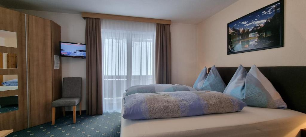 Postel nebo postele na pokoji v ubytování Pension Schweizerhof