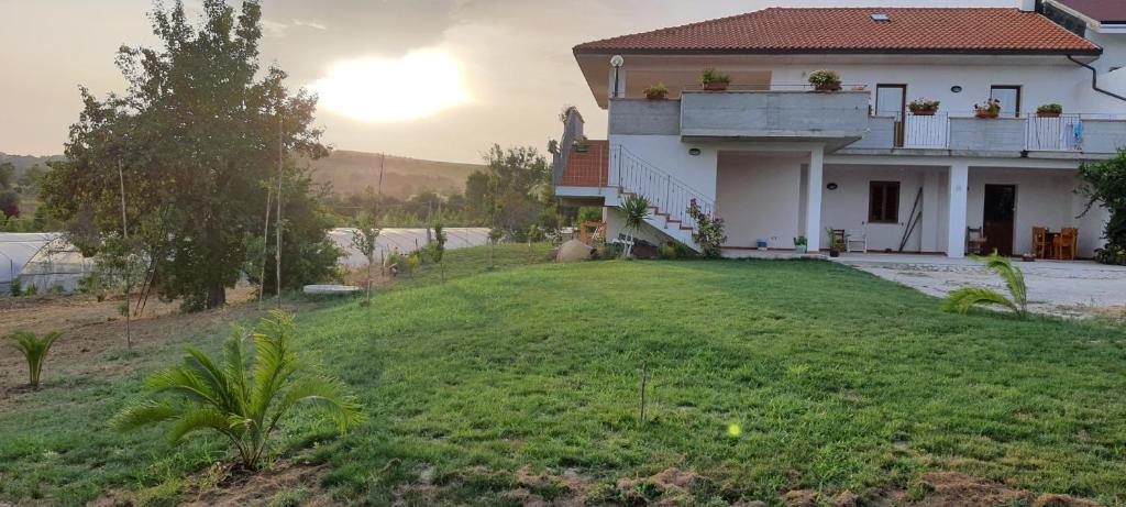 a house with a large yard in front of it at Casa Vacanze Cerreto 3 in Miglianico