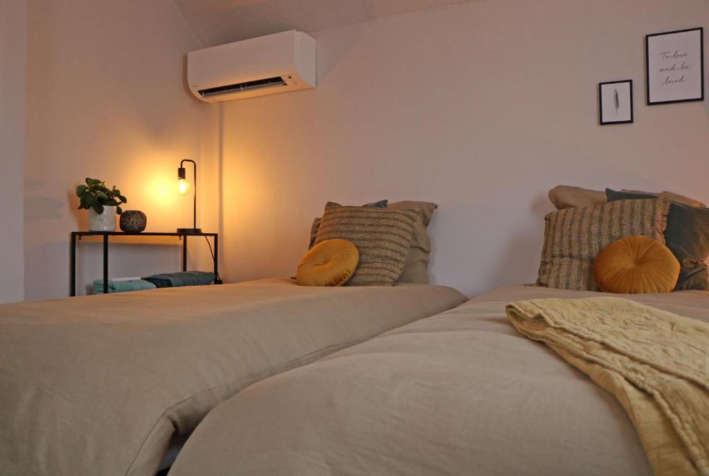 Ein Bett oder Betten in einem Zimmer der Unterkunft Maison des Étoiles