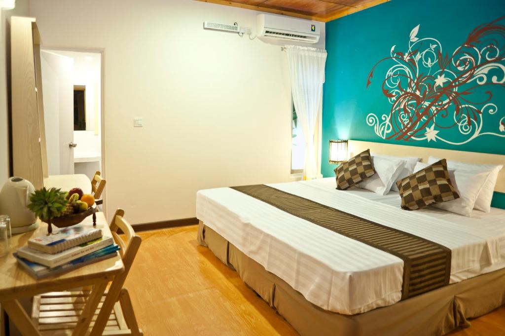 Postel nebo postele na pokoji v ubytování Stingray Beach Inn