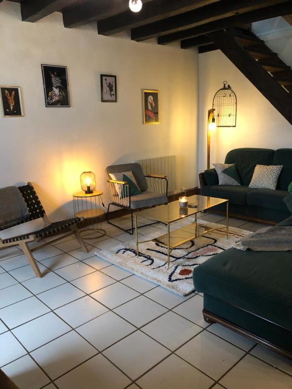 Posezení v ubytování Gîte à la ferme chaleureux avec cheminée