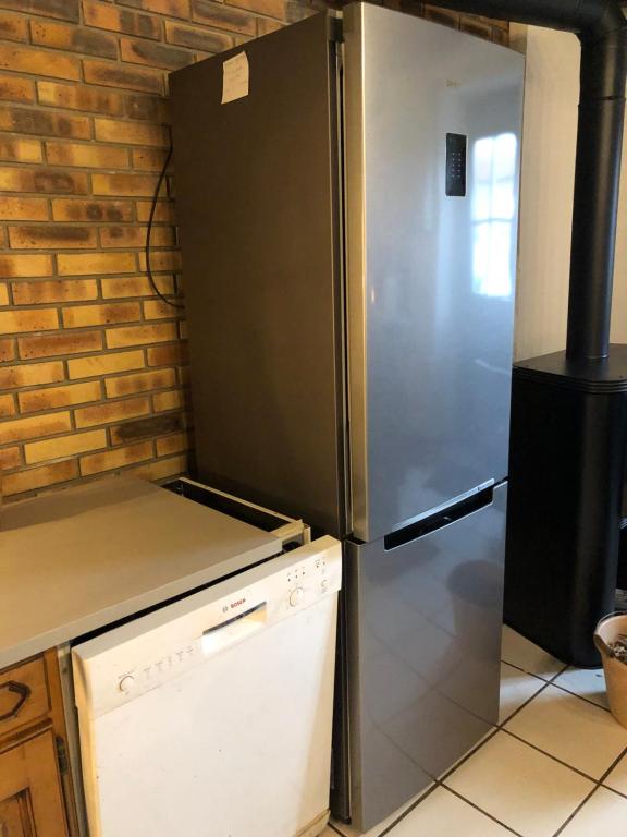 Kuchyň nebo kuchyňský kout v ubytování Gîte à la ferme chaleureux avec cheminée