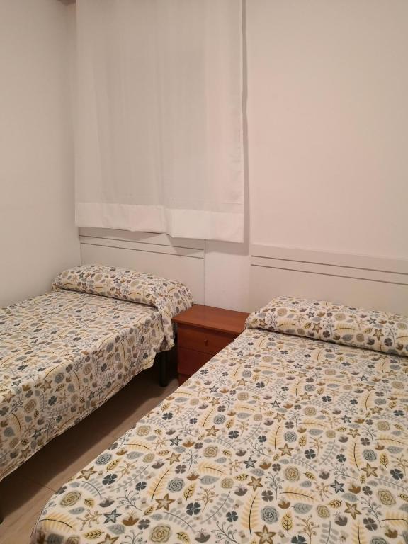 Postel nebo postele na pokoji v ubytování Centro Roquetas 5 minutos de la playa en Coche Garaje solo si esta disponible