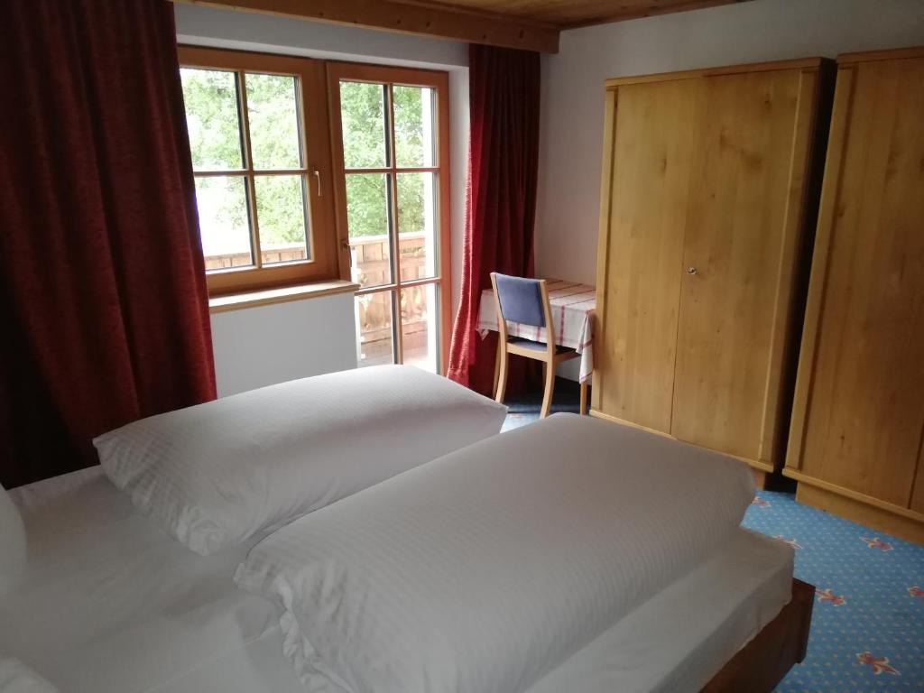 A bed or beds in a room at Försterhaus