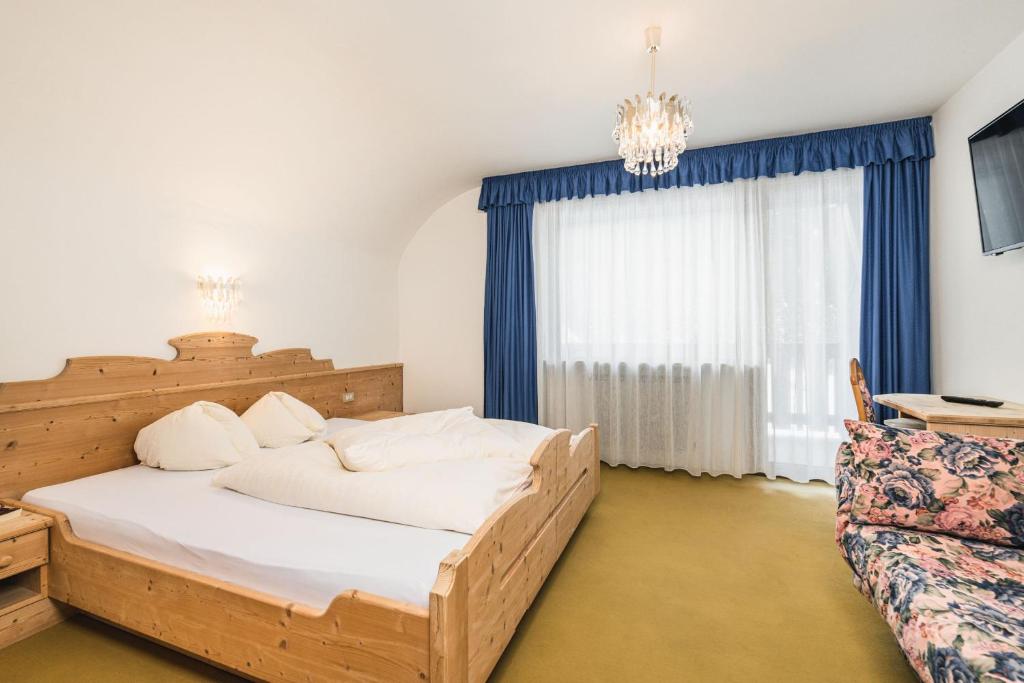 Postel nebo postele na pokoji v ubytování Hotel Wolf