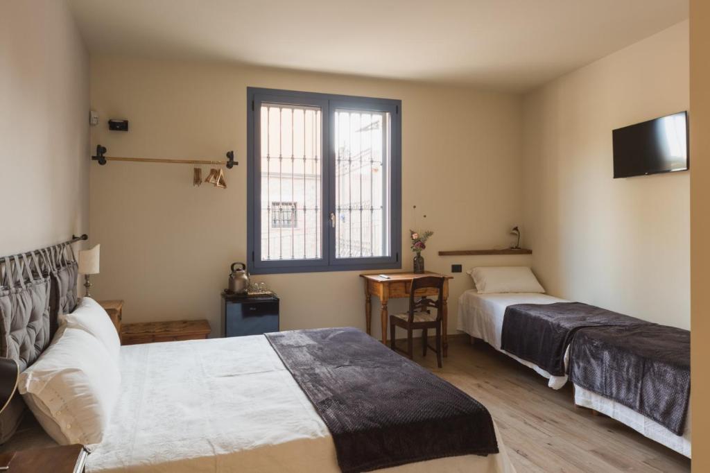 A bed or beds in a room at Corte Mira