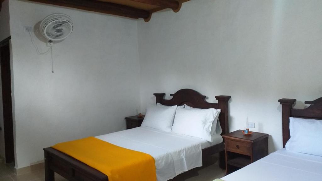 Postel nebo postele na pokoji v ubytování Posada Villa Paula