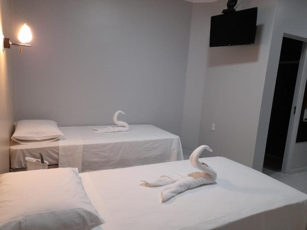 Postel nebo postele na pokoji v ubytování Pousada Vila de Charme