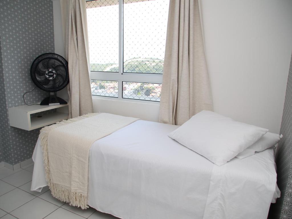 Un ou plusieurs lits dans un hébergement de l'établissement Excelente apartamento Verano Ponta Negra 02