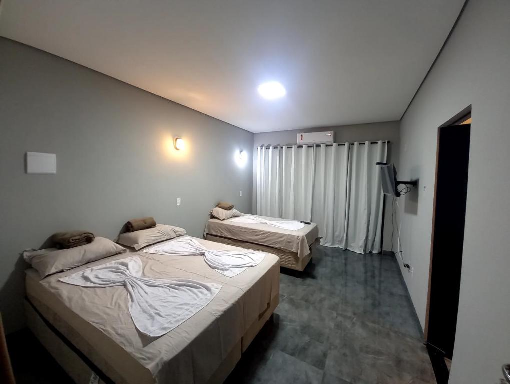Postel nebo postele na pokoji v ubytování Fervedouro e pousada Por Enquanto