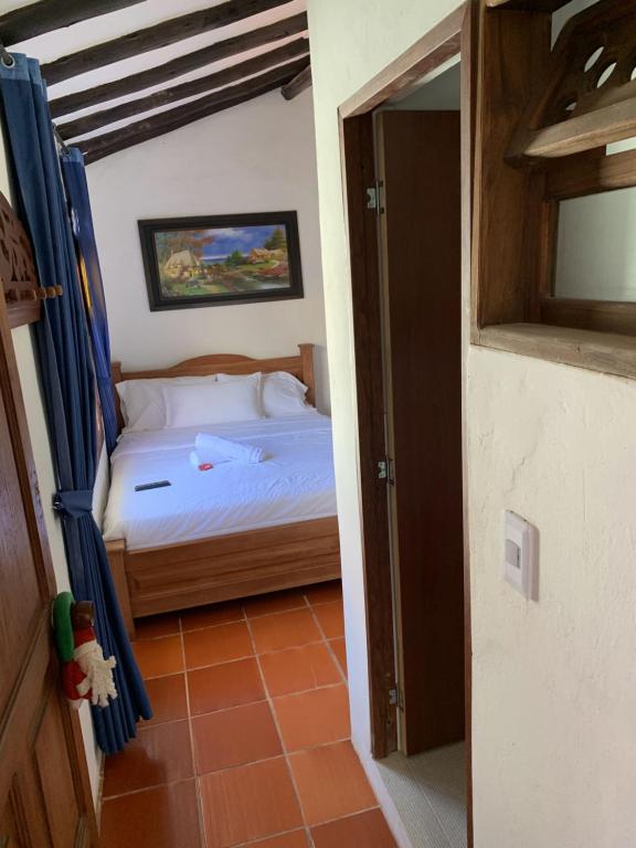 Postel nebo postele na pokoji v ubytování Hostal Home Sant Angelo