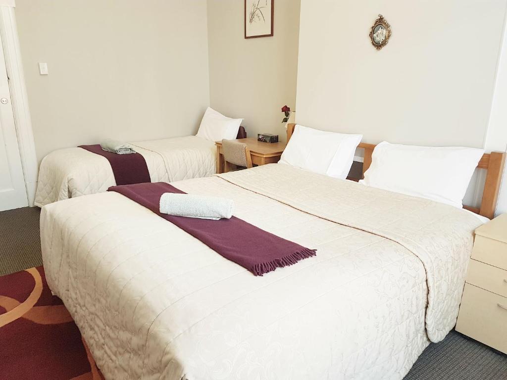 Postel nebo postele na pokoji v ubytování Dunedin Classic Stay