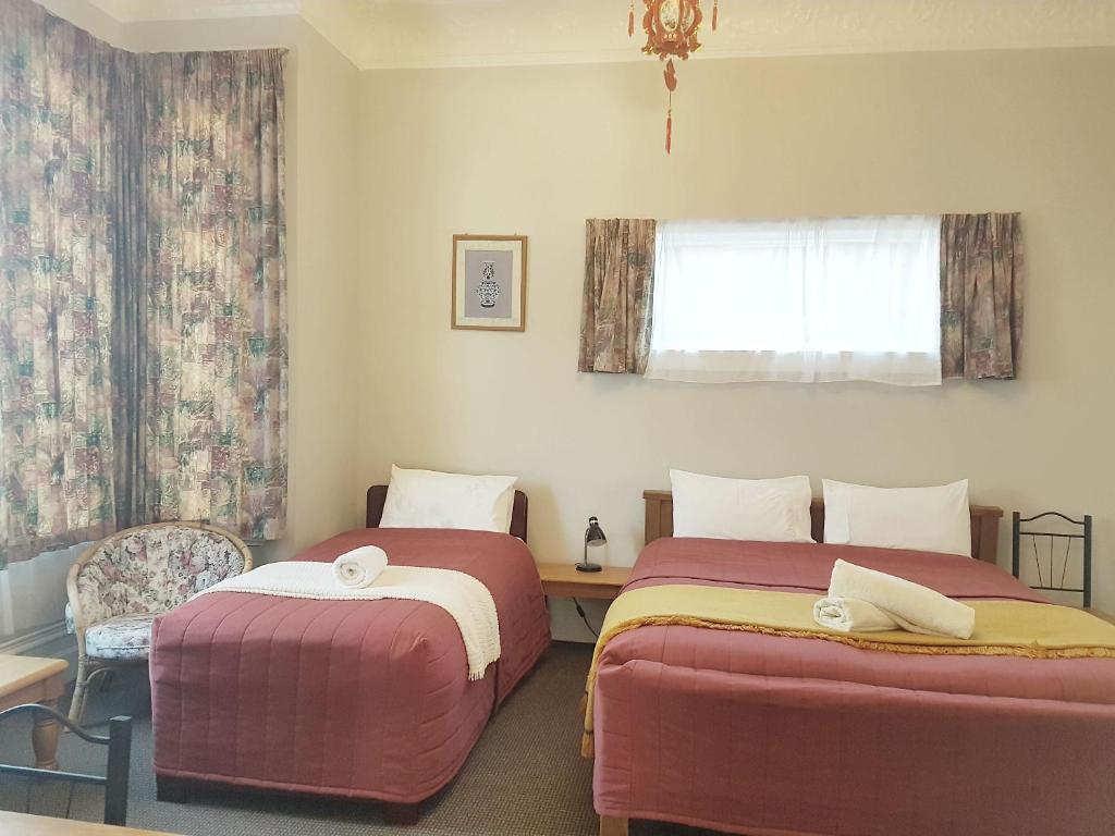 Postel nebo postele na pokoji v ubytování Dunedin Classic Stay