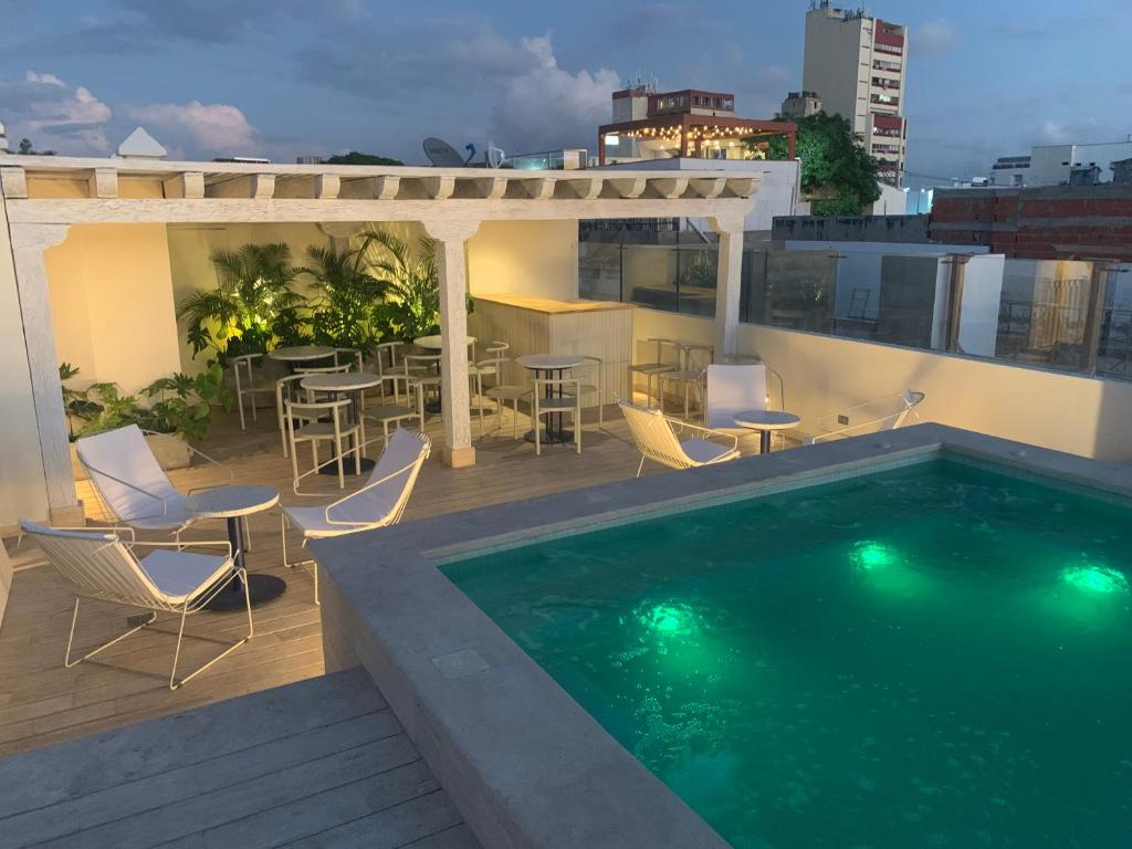 a swimming pool on the roof of a building at B Haus Hotel Boutique in Cartagena de Indias