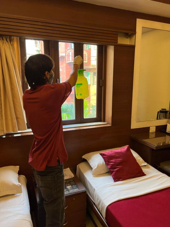 Postel nebo postele na pokoji v ubytování Hotel Aston