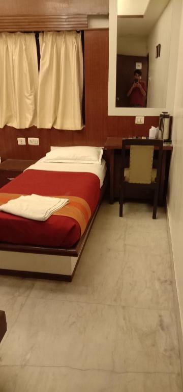 Postel nebo postele na pokoji v ubytování Hotel Aston