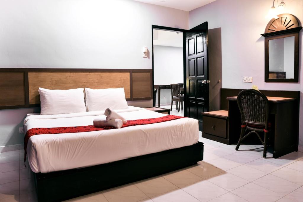 Ένα ή περισσότερα κρεβάτια σε δωμάτιο στο Leisure Cove Hotel and Apartments
